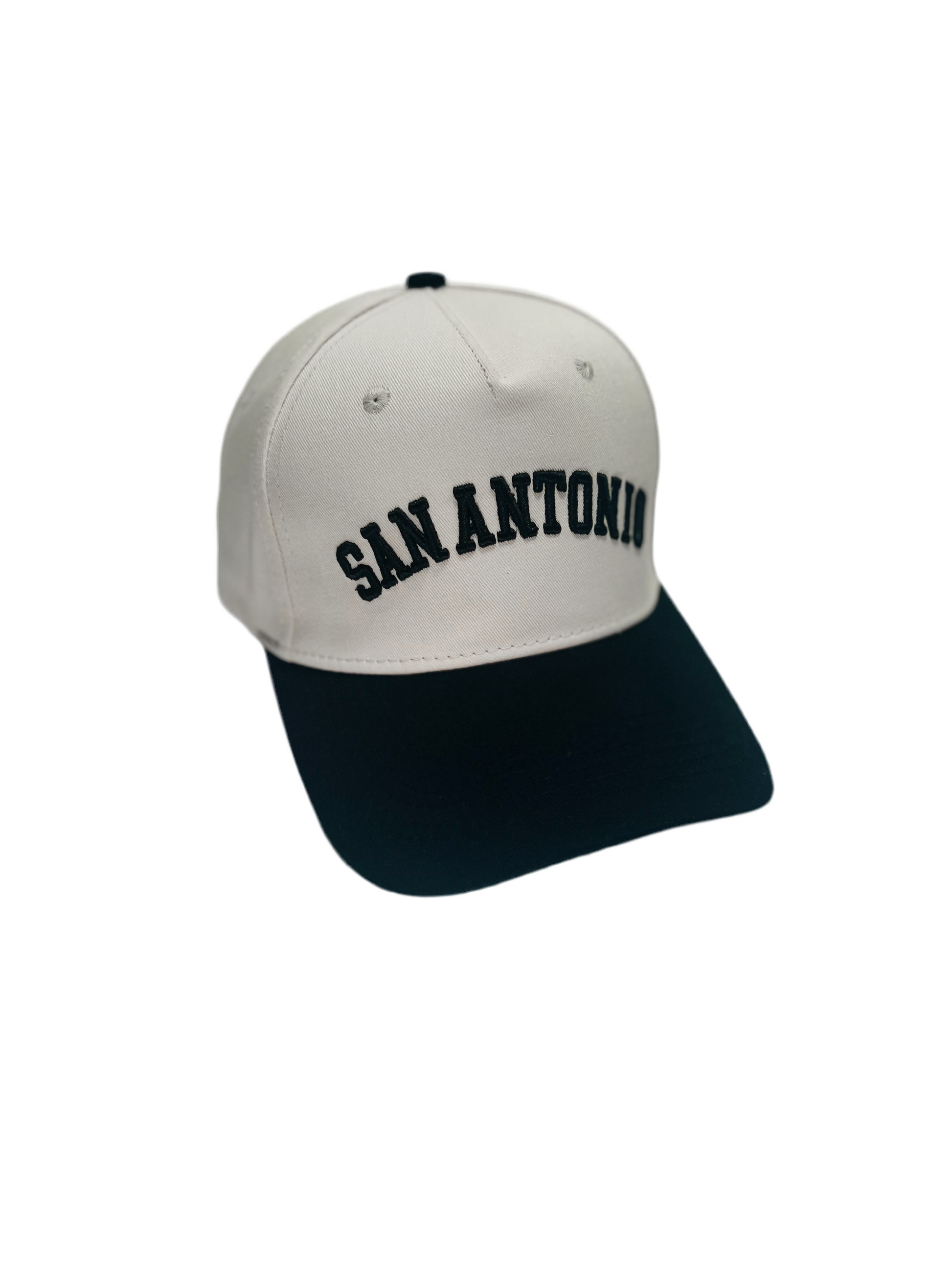 San Antonio Hat in black and cream, featuring premium 3D embroidery and adjustable buckle for a perfect fit.